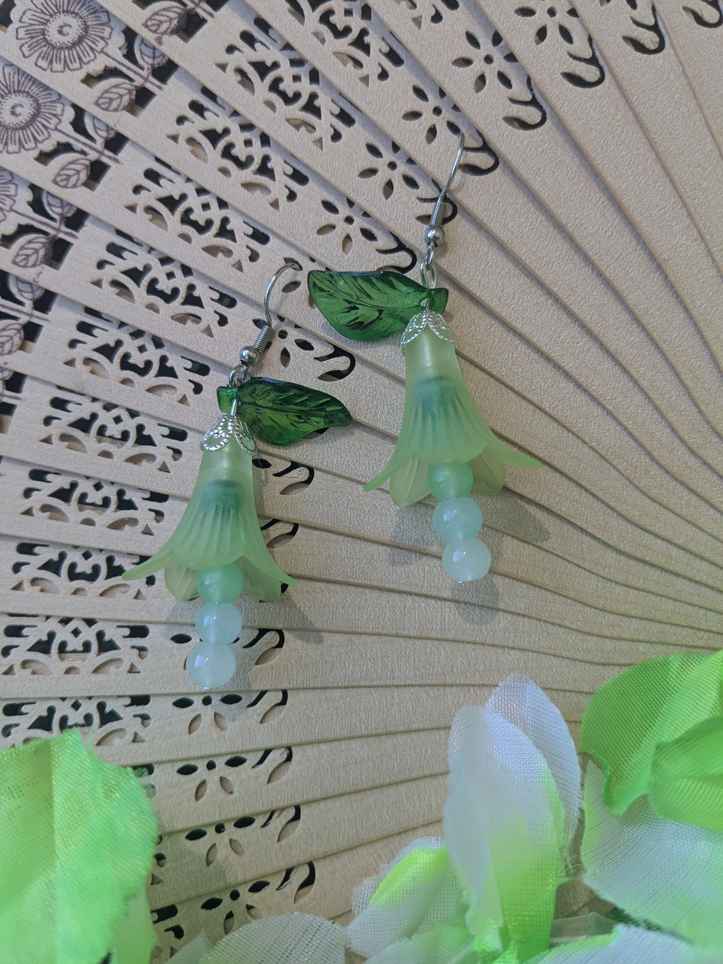 Earring with beads and flower