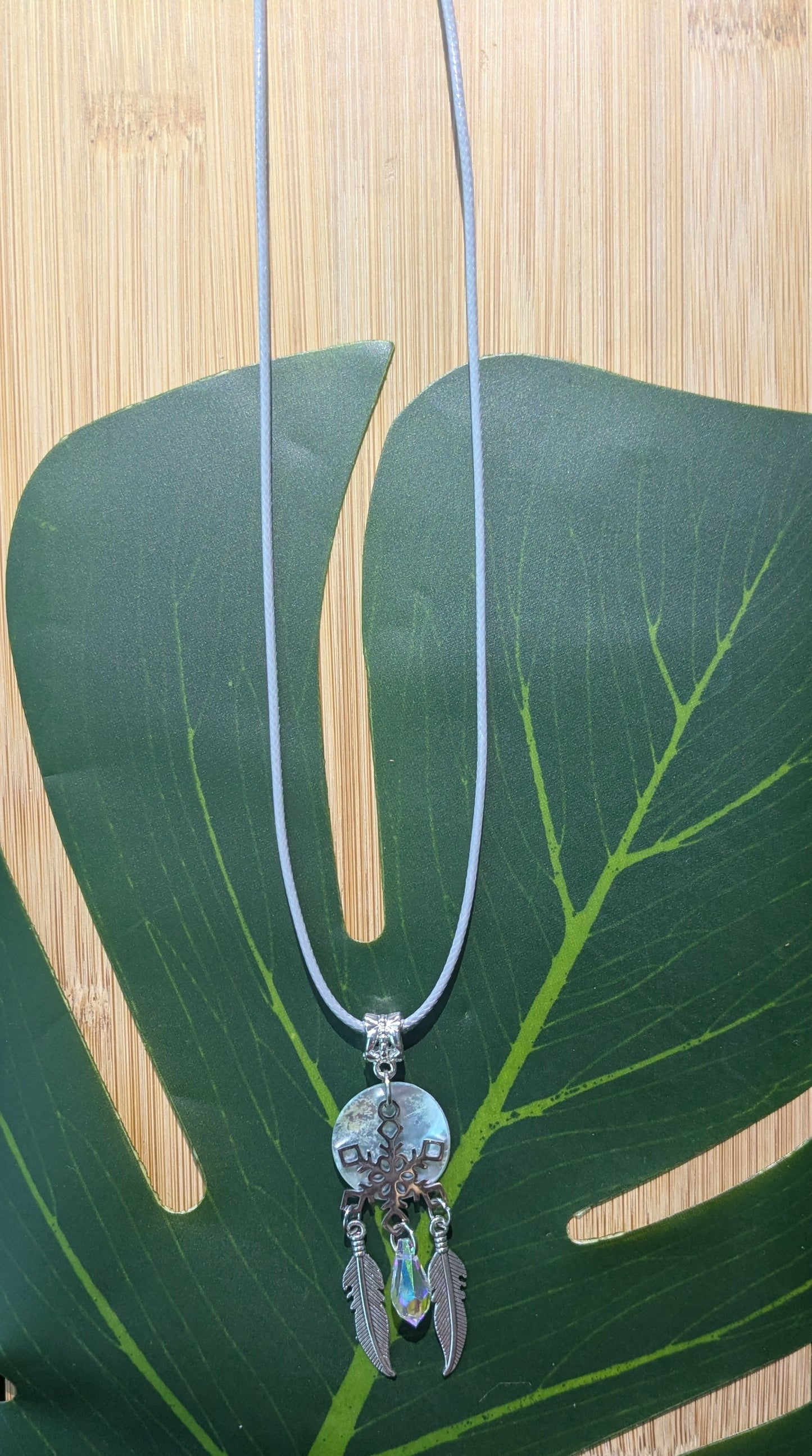 Leather necklace with shell and pendant
