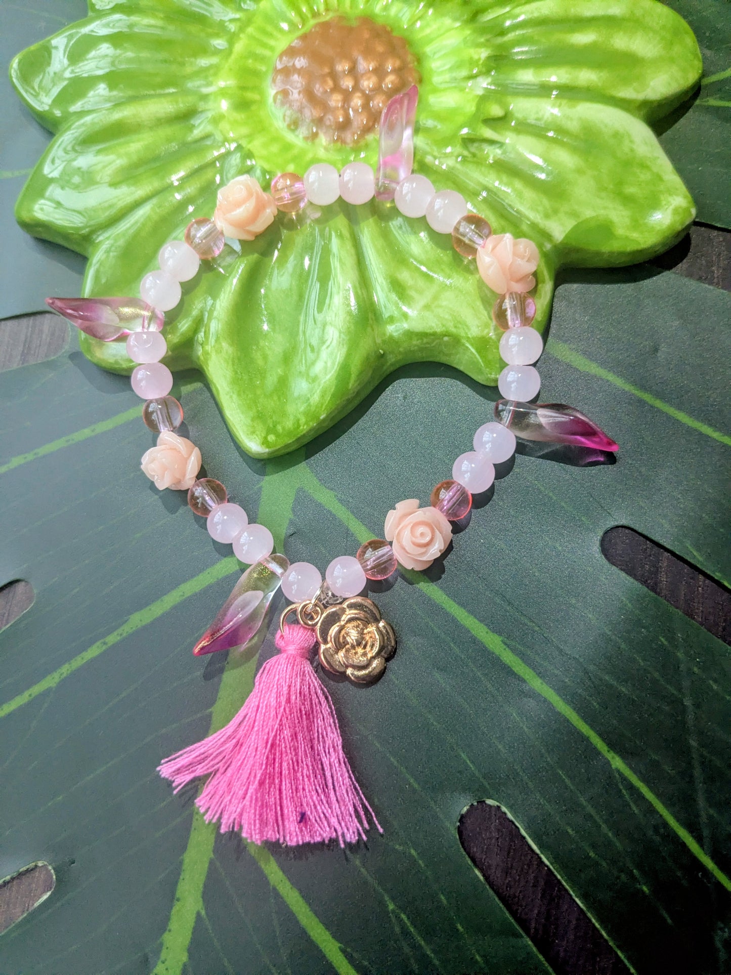 Beaded bracelet with tassel and charm