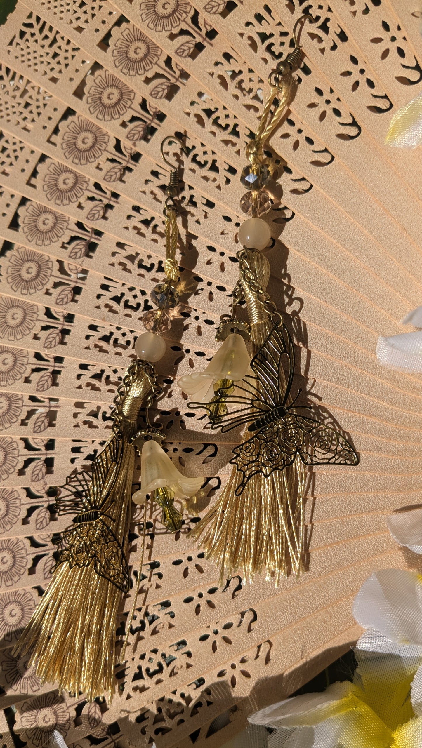 Earring with tassel, butterfly and flowers