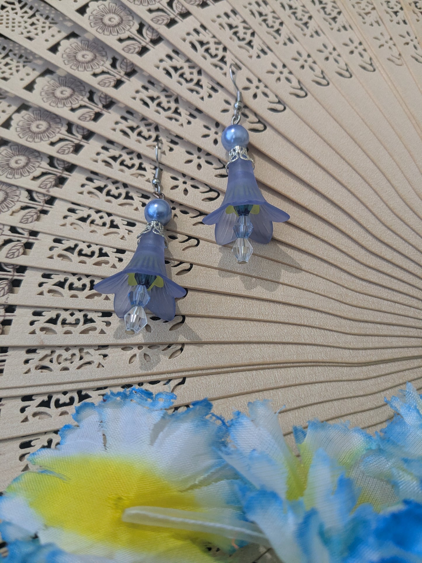 Earring with beads and flower