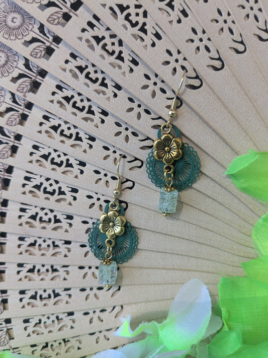 Earring with bead and flower pendant