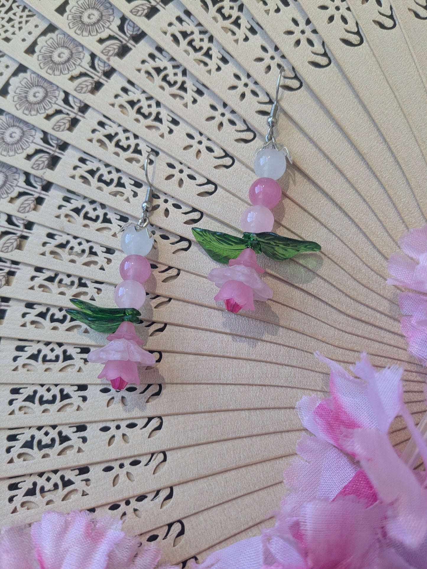 Earring with beads and flower