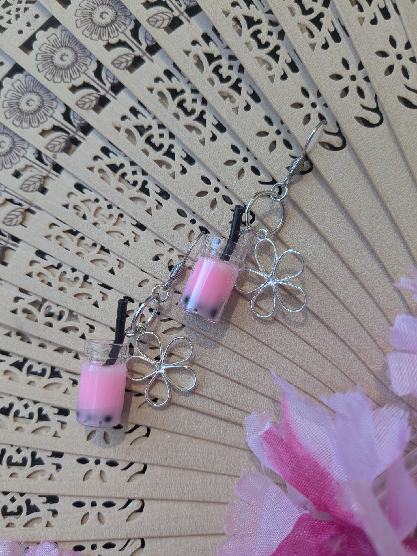 Earring with pendant and flower