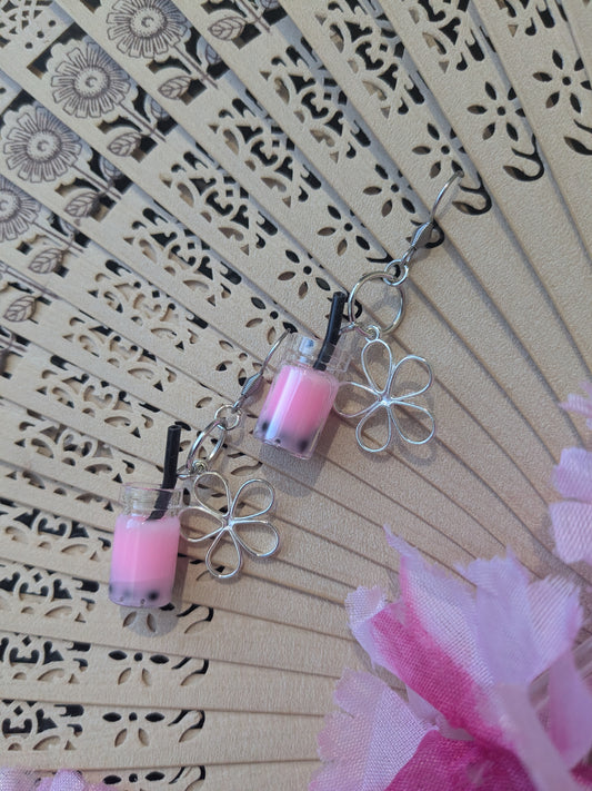 Earring with pendant and flower