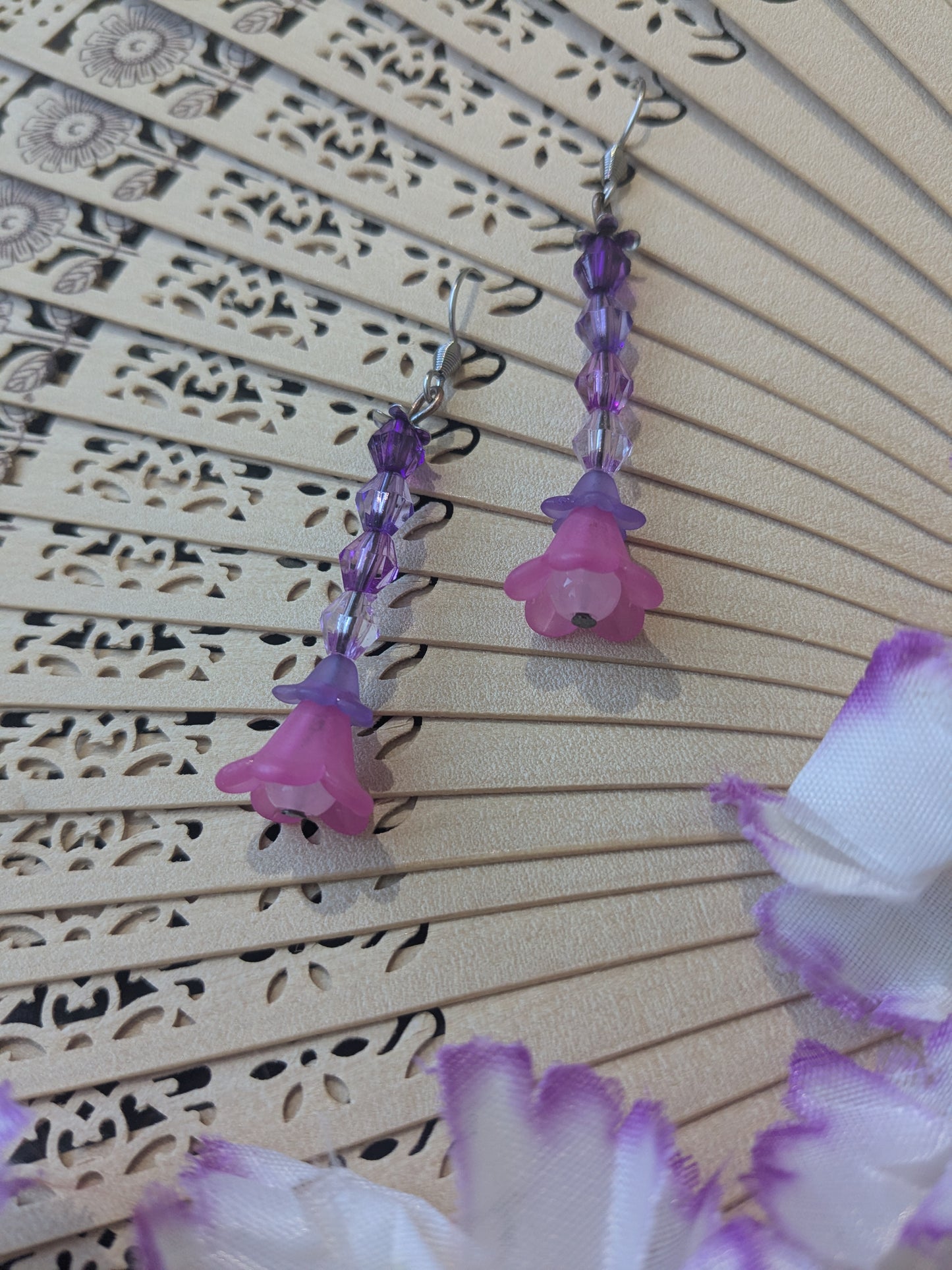 Earring with beads and flower