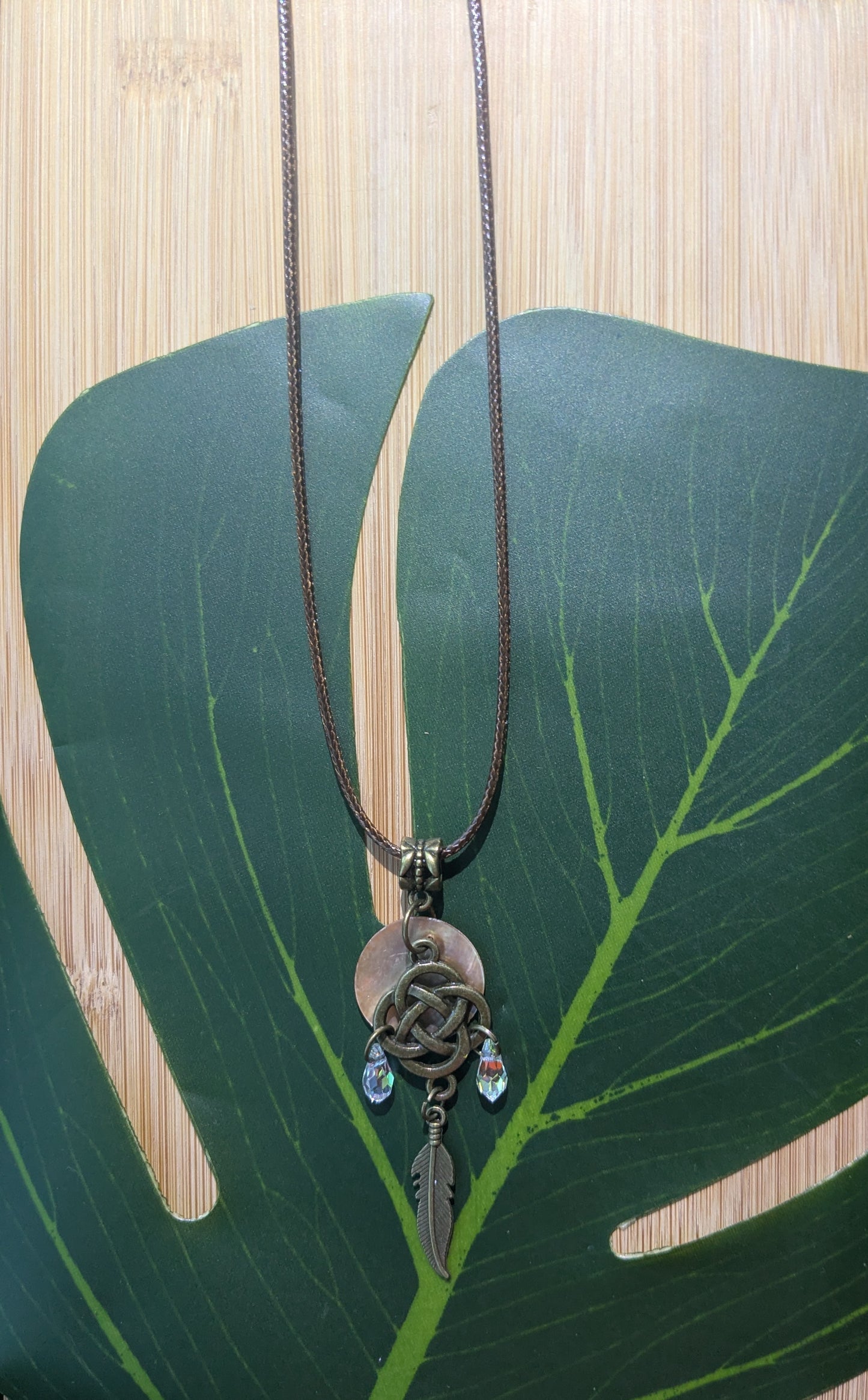 Leather necklace with shell and pendant