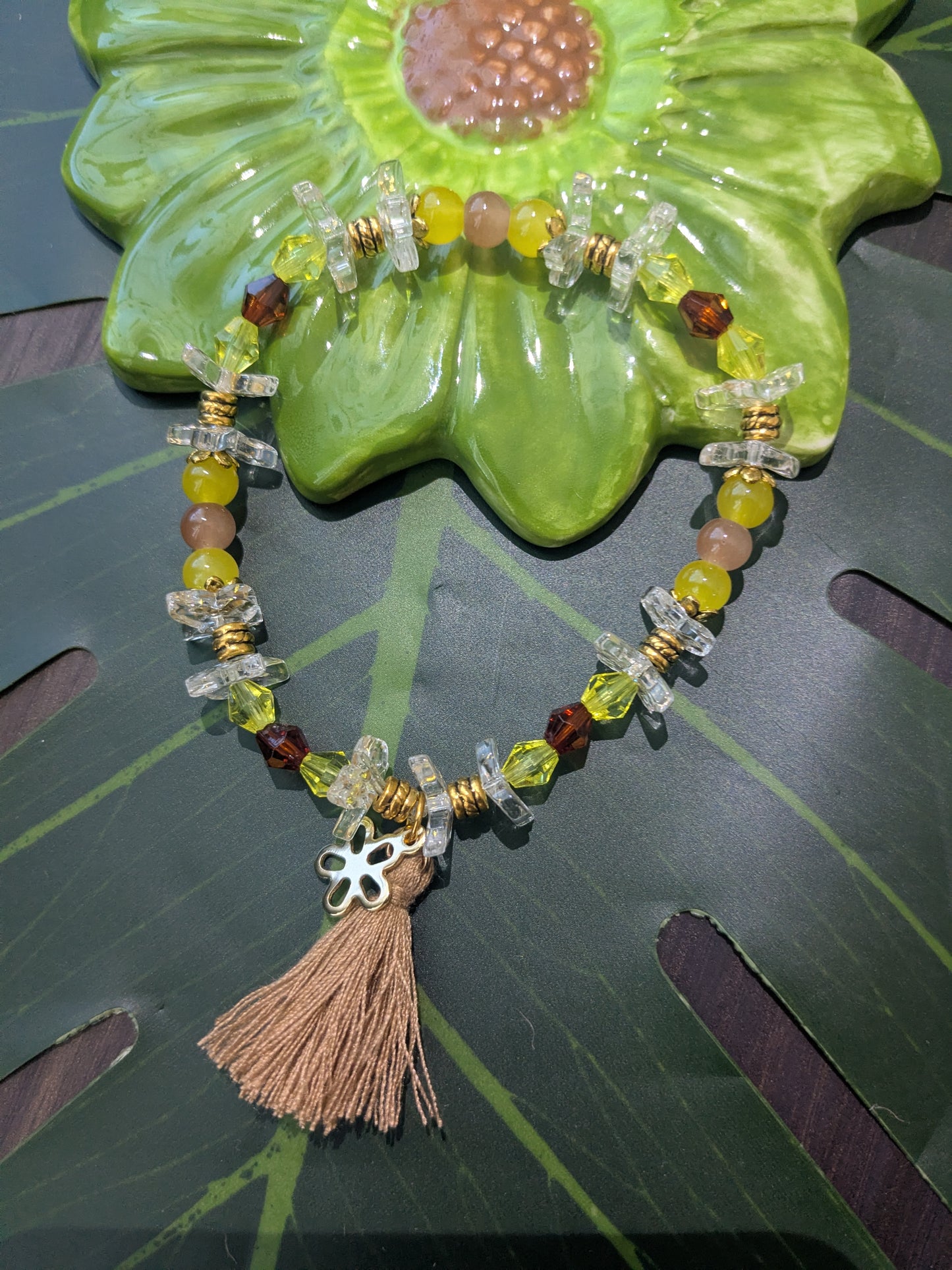 Beaded bracelet with charm and tassel