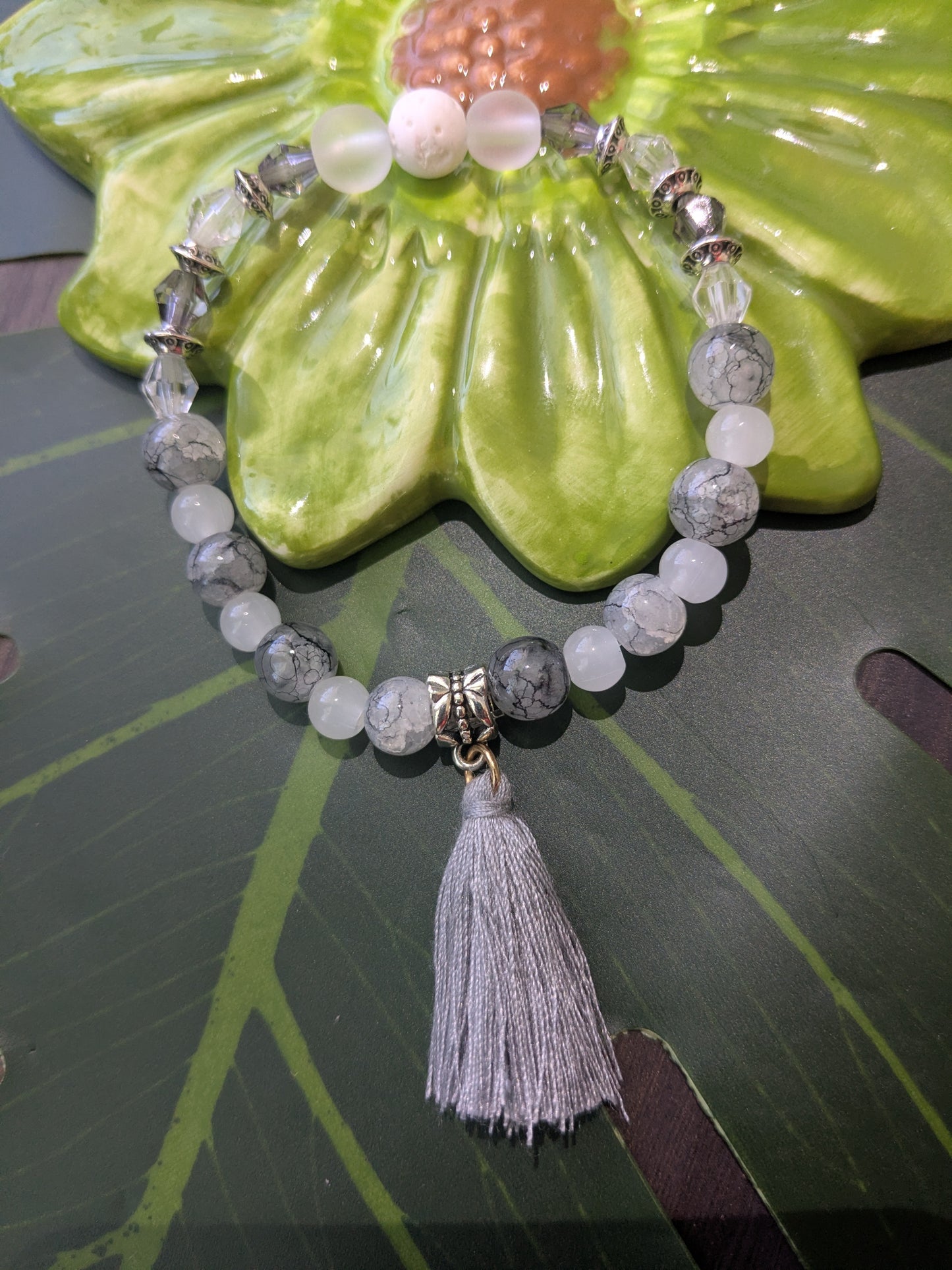 Beaded bracelet with lava rock and tassel