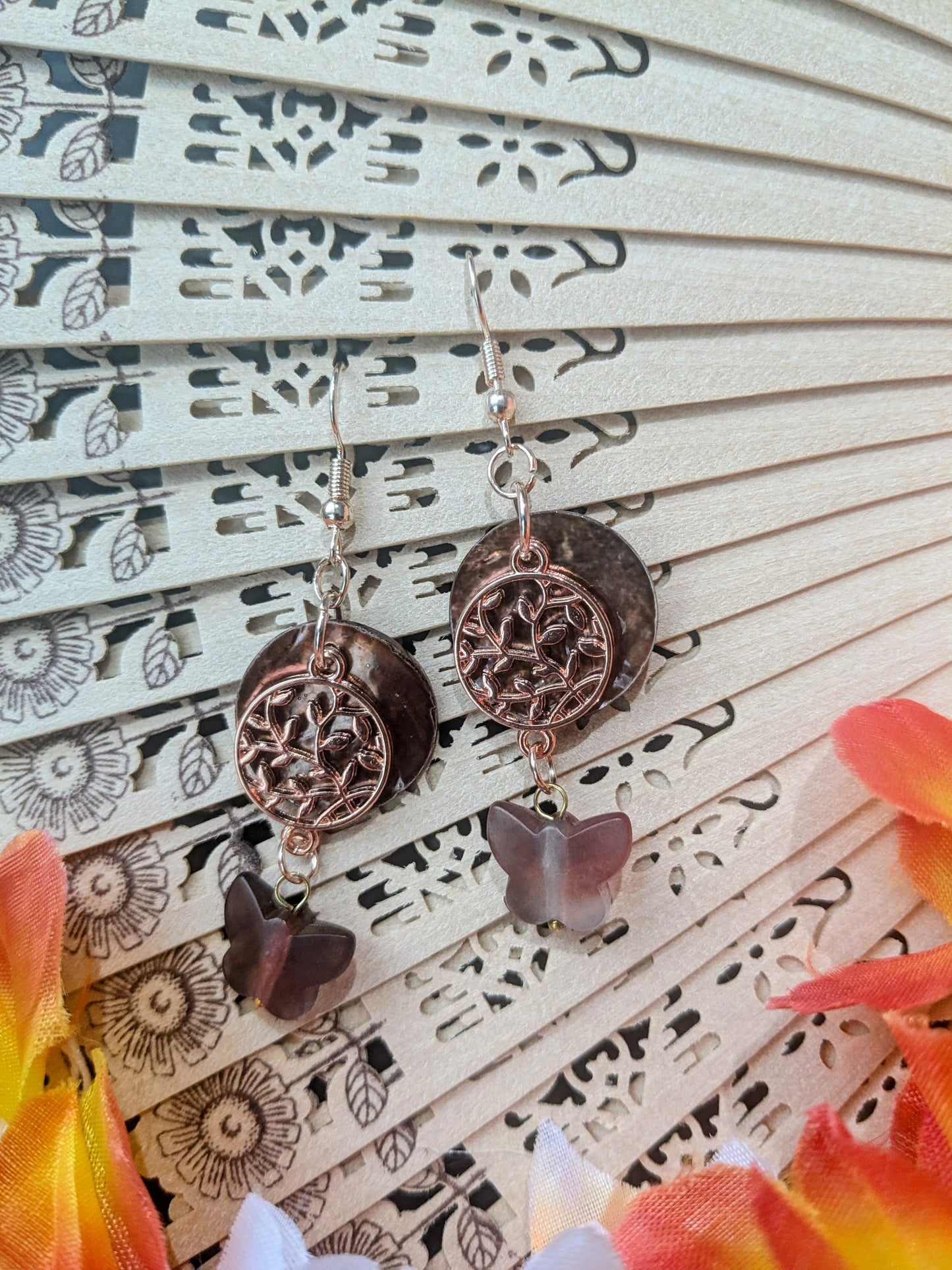 Earrings with shell and charms