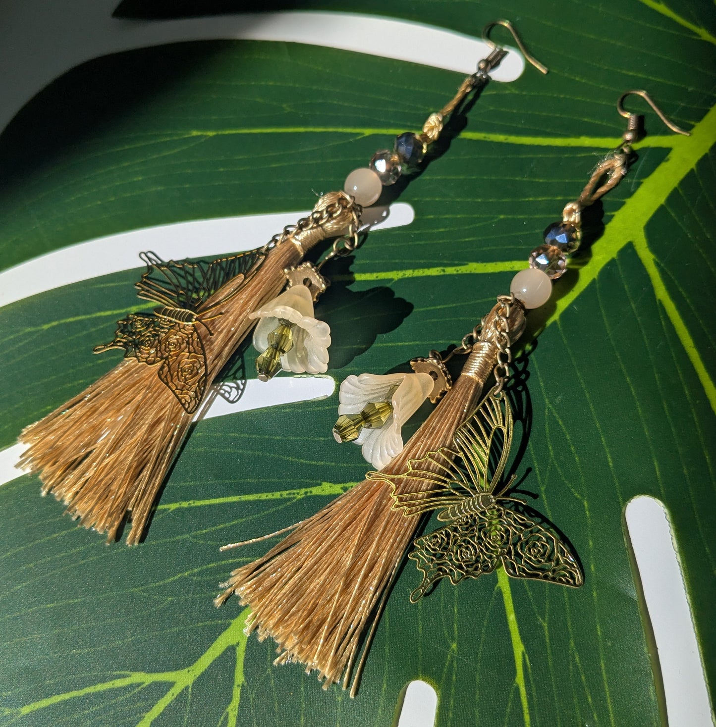 Earring with tassel, butterfly and flowers