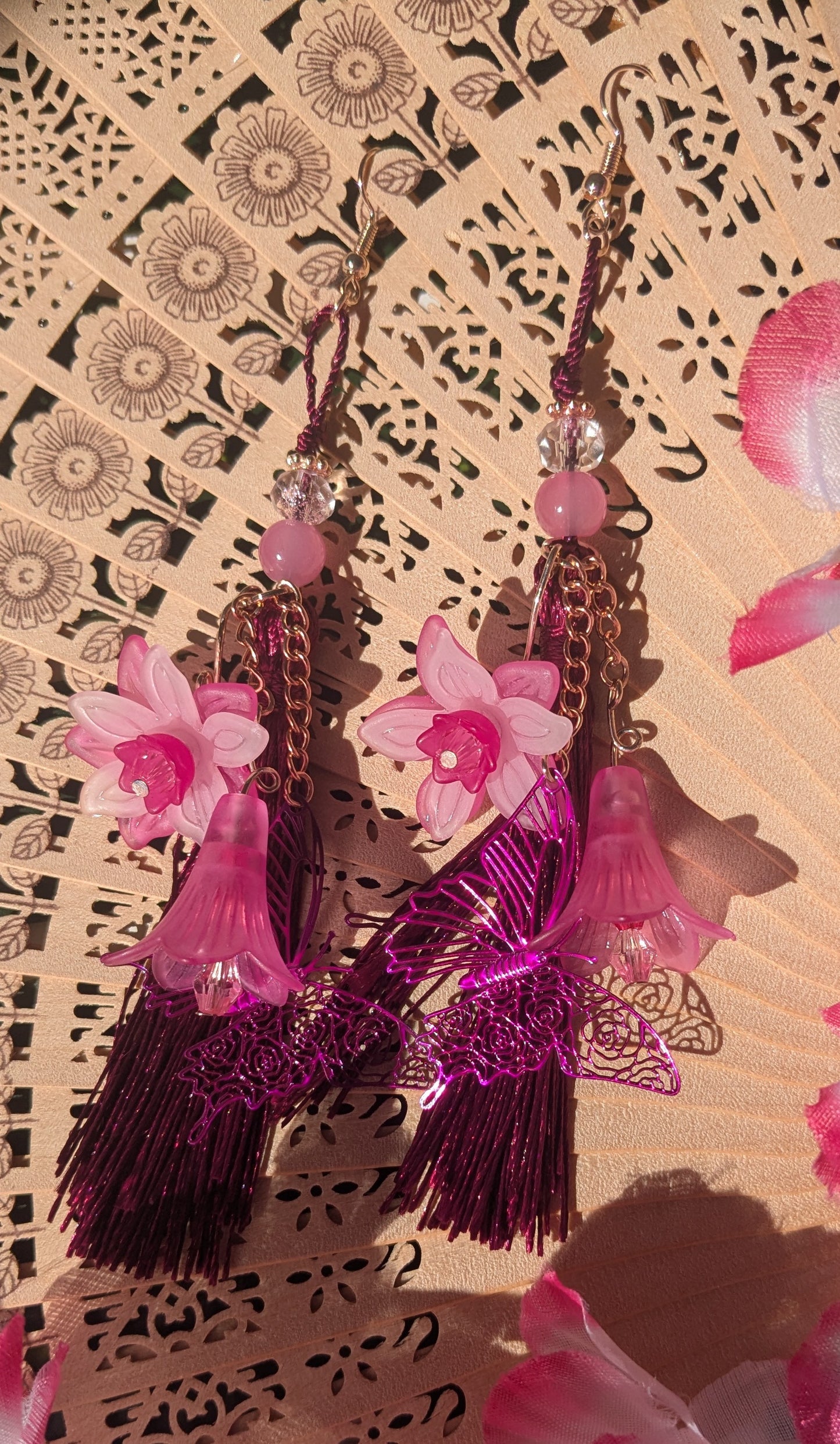 Earring with flowers, butterfly, and tassel