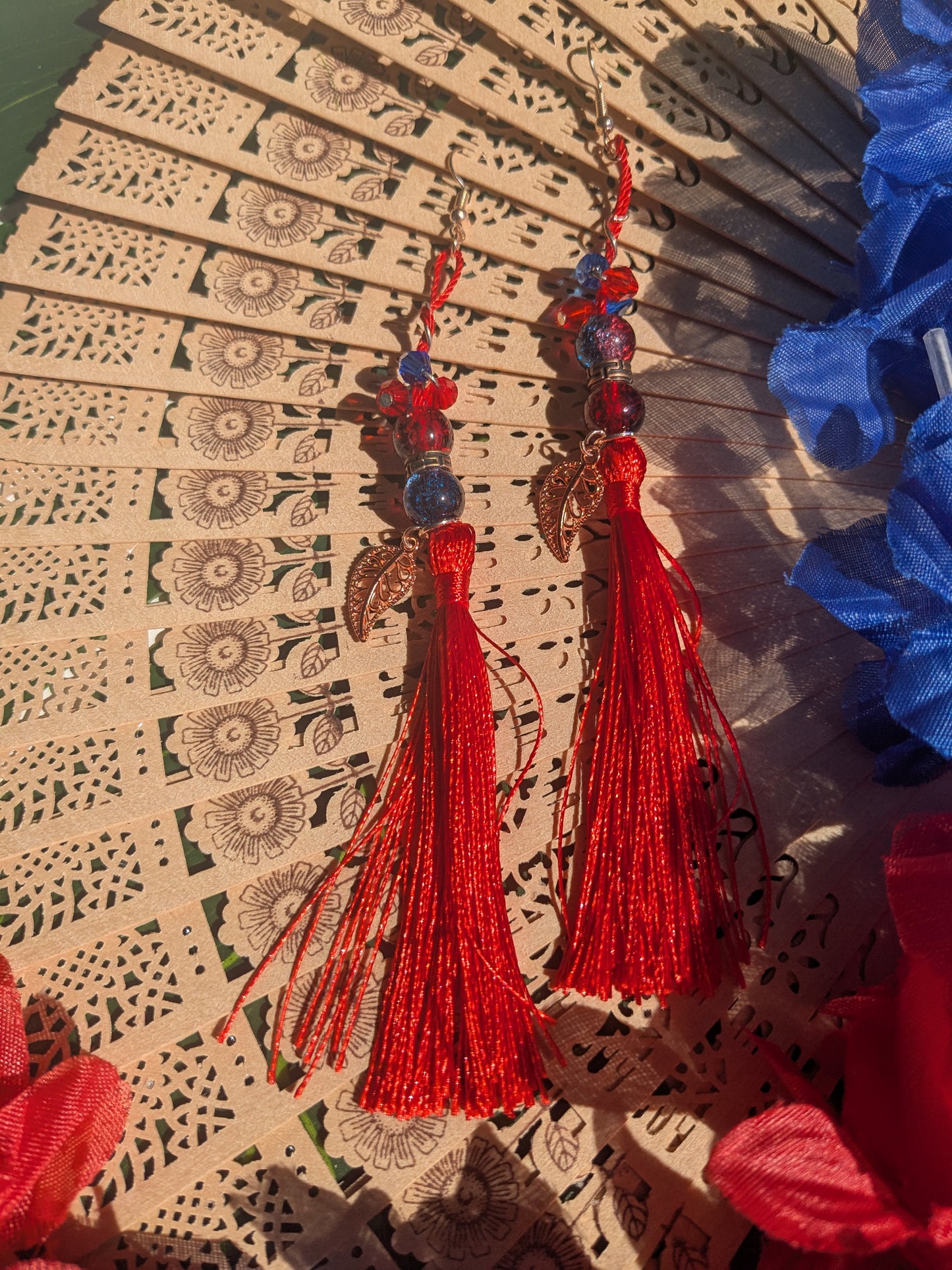 Earring with tassel, beads and leaf pendant
