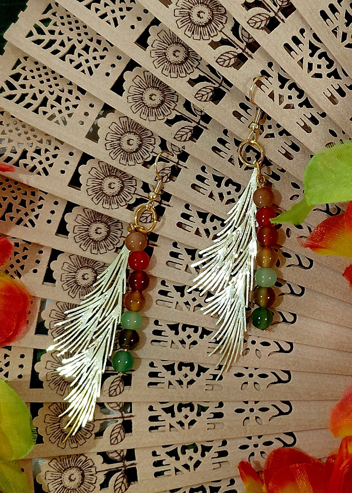 Earring with beads and charm