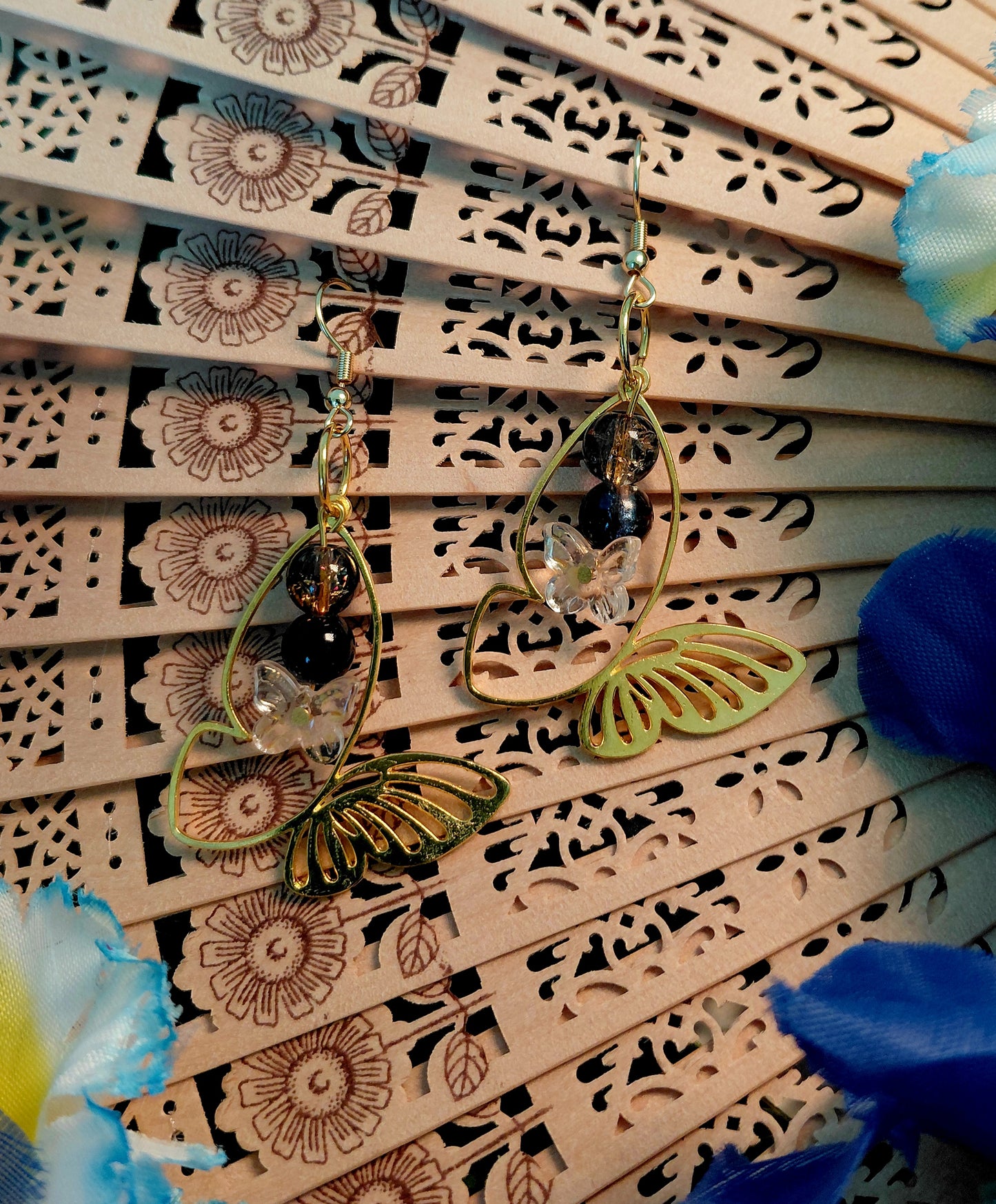 Earring with beads and butterfly